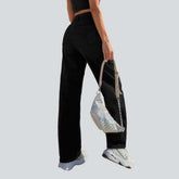 Wide-leg black jeans with chain